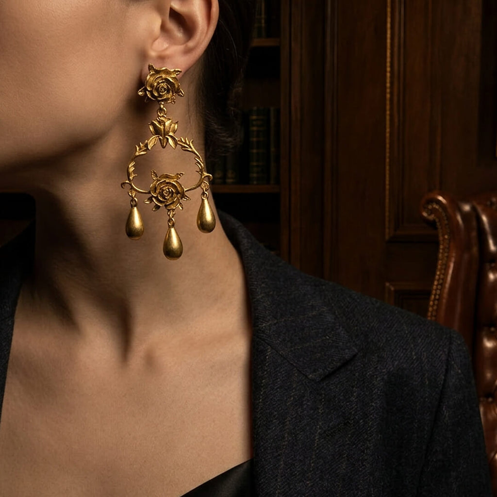 Styling 1980s runway-inspired bold gold rose dangle earrings with a tailored blazer.