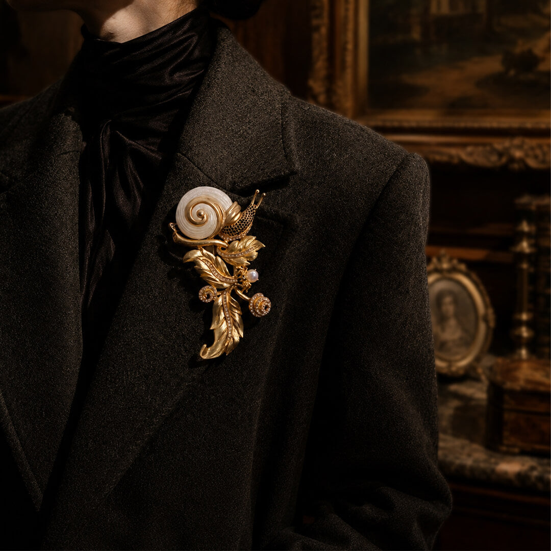 Styling a massive 1980s runway-inspired gold snail statement brooch with a tailored blazer.
