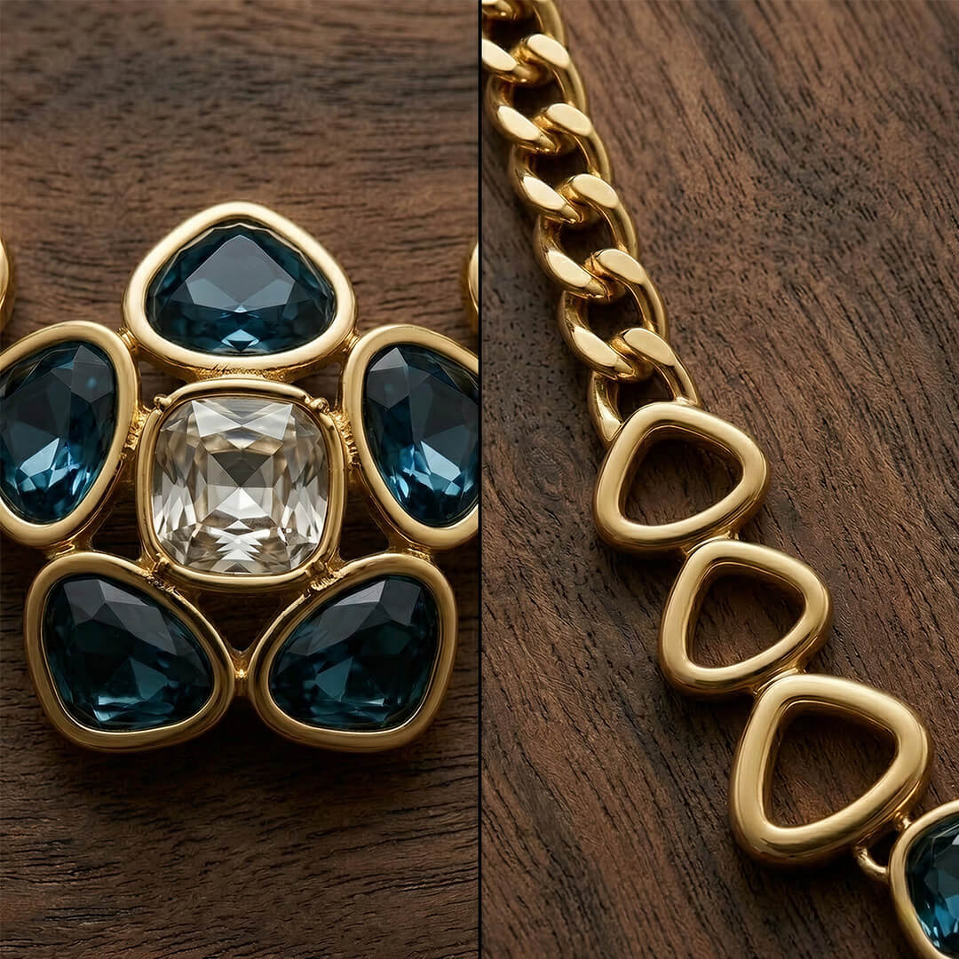 Alt Text: Macro shot showing the intricate details of a vintage-inspired jewelry piece, featuring a large clear central crystal surrounded by azure blue stones and a heavy gold-tone chain.