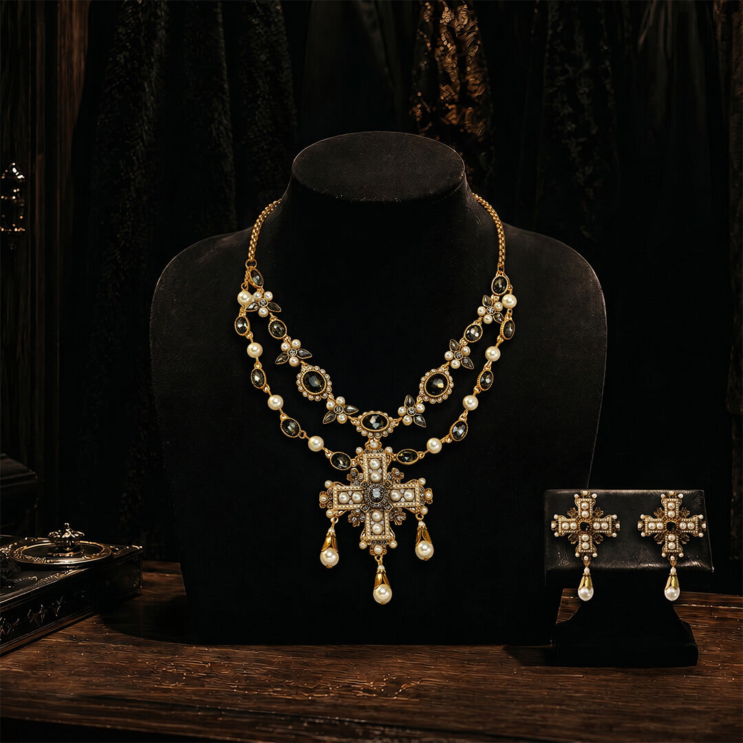 Full view of the Byzantine empress pearl cross necklace and earrings set on a black velvet display.