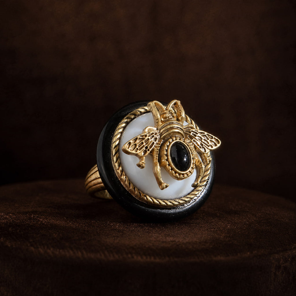 Vintage-Inspired bee cameo statement ring with a gold-tone bee, black stone accent, and ivory-tone face.