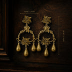 Dimensions and size chart for the vintage-inspired gold rose statement earrings, length 9 centimeters.