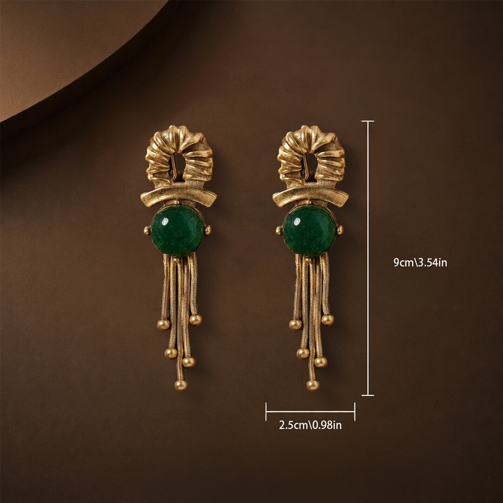 Dimensions showing 9cm length and 2.5cm width of the emerald cabochon earrings