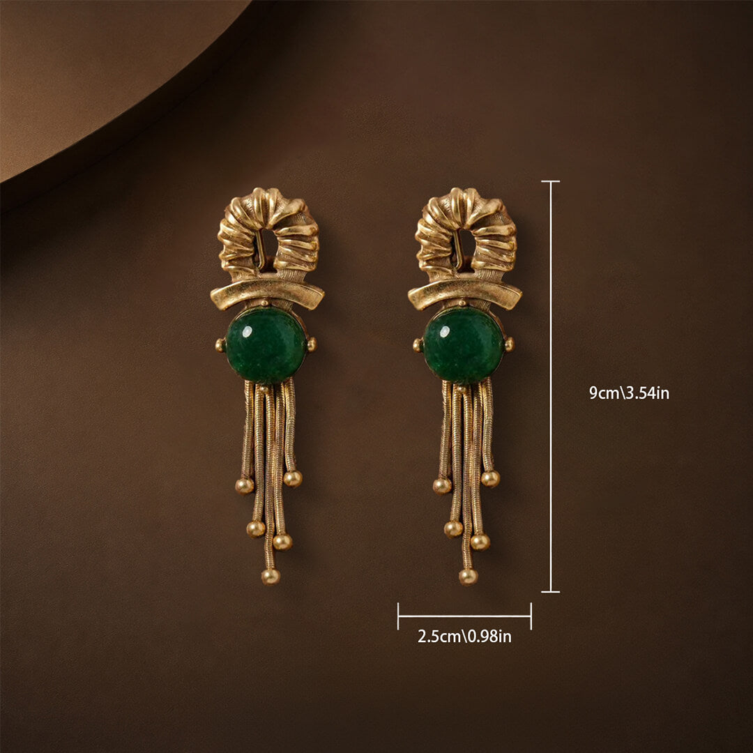 Dimensions showing 9cm length and 2.5cm width of the emerald cabochon earrings