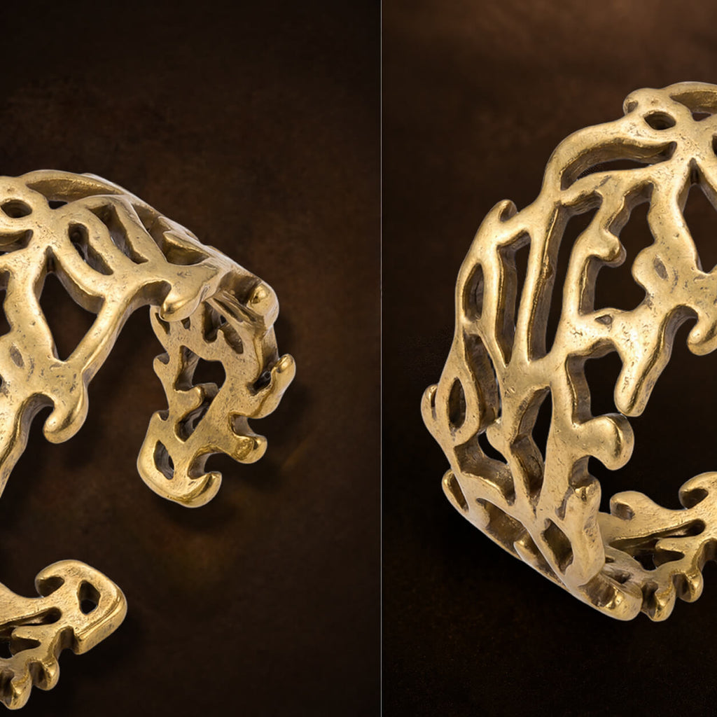 Macro detail shot of the textured gold branch open cuff ring.