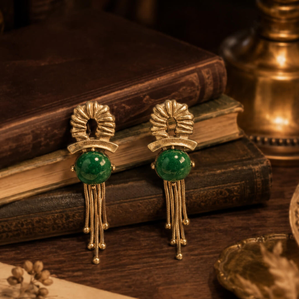 Antique books displaying heirloom quality emerald green cabochon tassel earrings