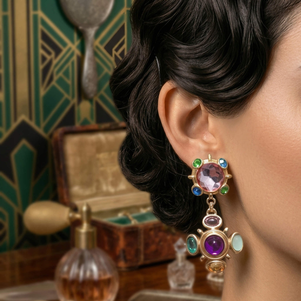 Retro 80s glamorous styling with oversized gold and jewel-tone cross ear clips.
