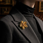 Retro Style gold alloy floral brooch with zircon accents on black blazer and turtleneck
