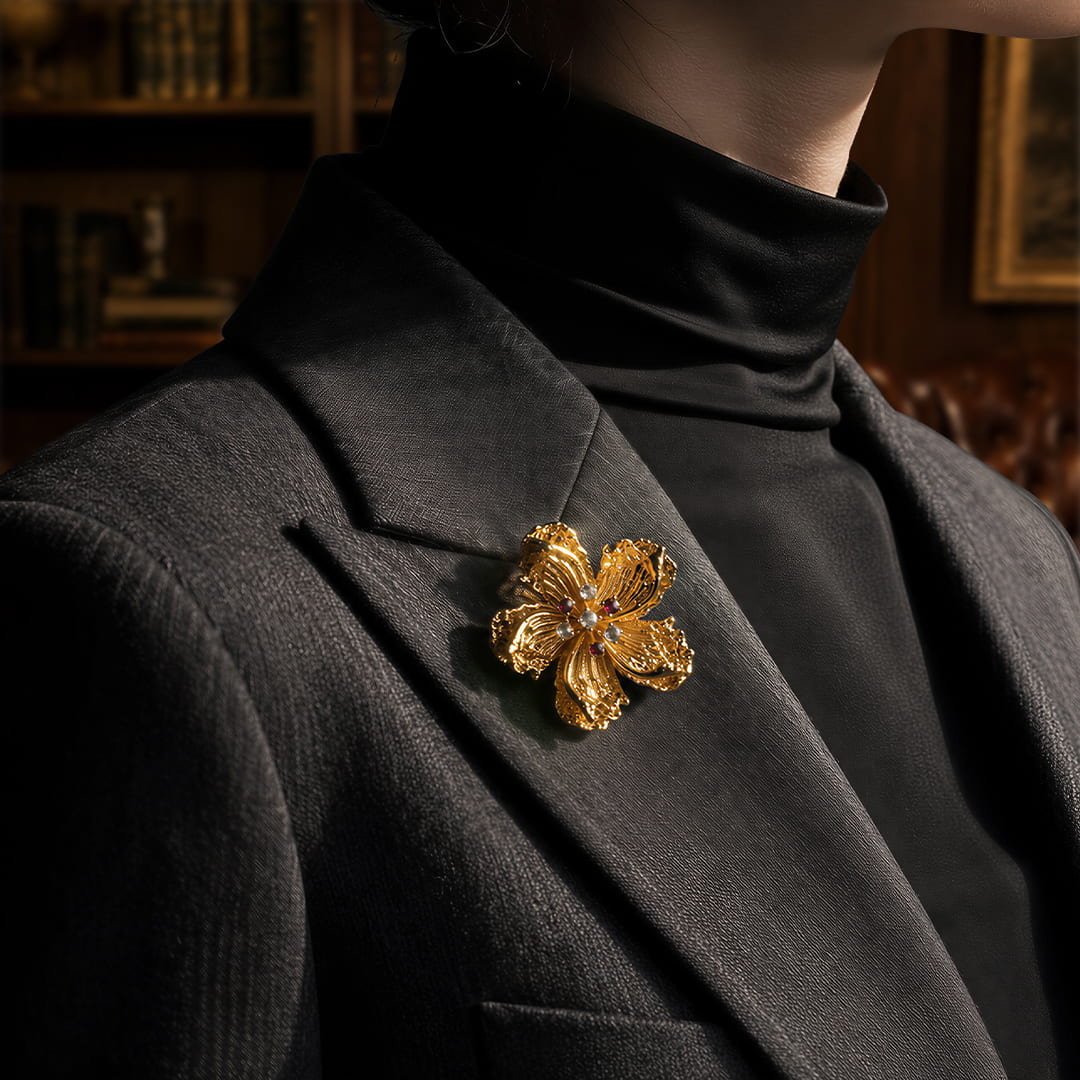 Retro Style gold alloy floral brooch with zircon accents on black blazer and turtleneck