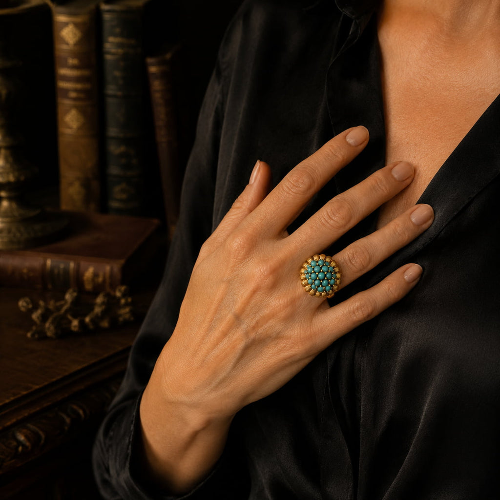 Vintage-Inspired turquoise cluster statement ring worn with a black evening outfit.