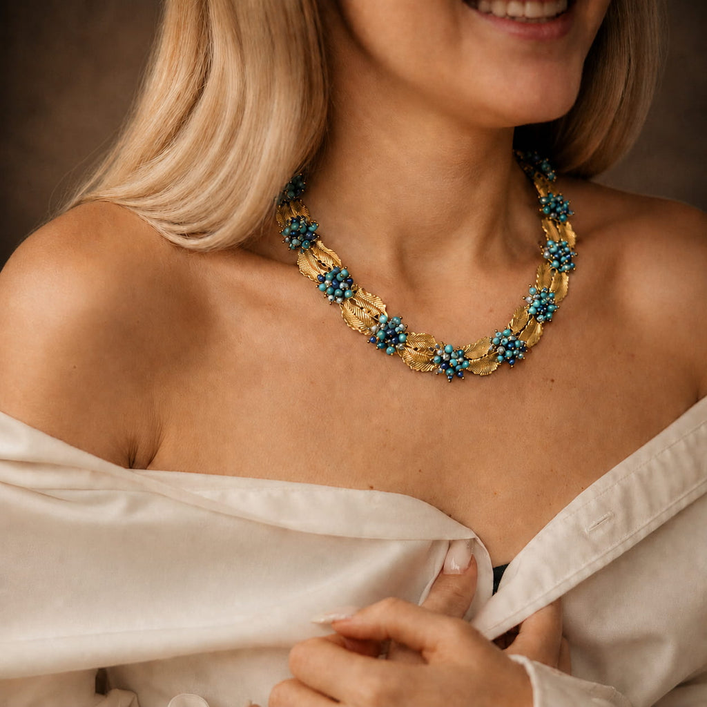 Woman wearing a Retro Style turquoise leaf statement necklace with an off-shoulder evening outfit.
