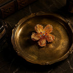 Vintage-Inspired gold alloy floral brooch with zircon accents on vintage-style tray